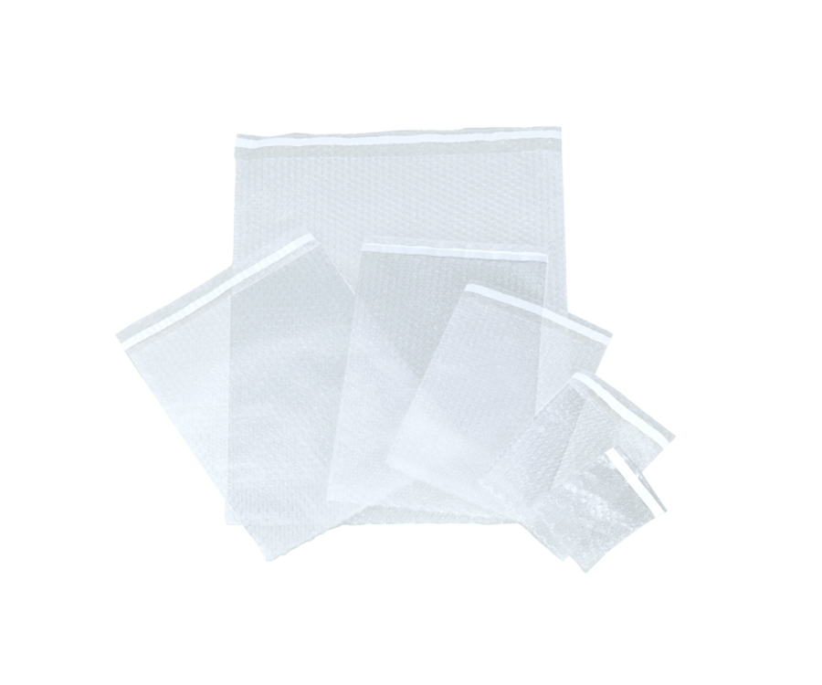 A set of clear bubble wrap pouches in various sizes arranged on a white background. Bubble Wrap® Clear 3/16 in. Bubble Bag (8 in. x 15.5 in., 350/Case)